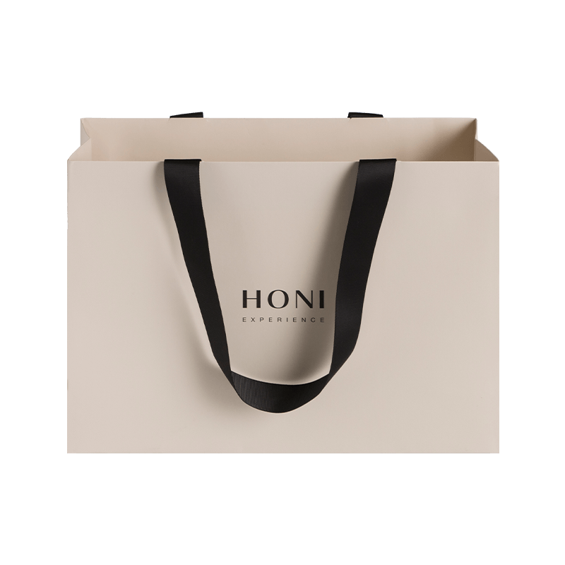 Le cadeau de luxe de mode fait sur commande met en sac le sac d'emballage de courses de sac de papier blanc pour des vêtements